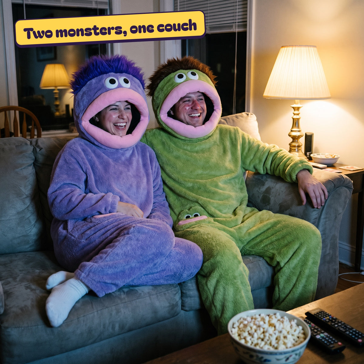 A couple laughing on the sofa in purple and green Chompsies